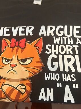 Yumiko Black Tee with Orange Striped Cat Graphic and White Text